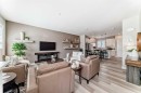 116 Precedence Way, Cochrane, AB  - Indoor Photo Showing Living Room With Fireplace 