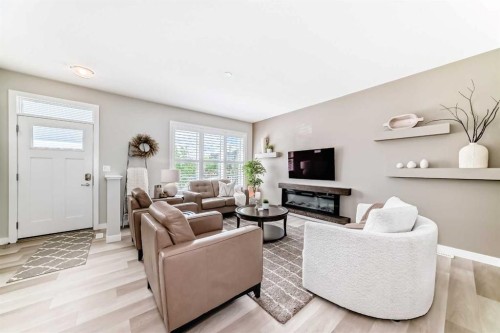 116 Precedence Way, Cochrane, AB - Indoor Photo Showing Living Room With Fireplace