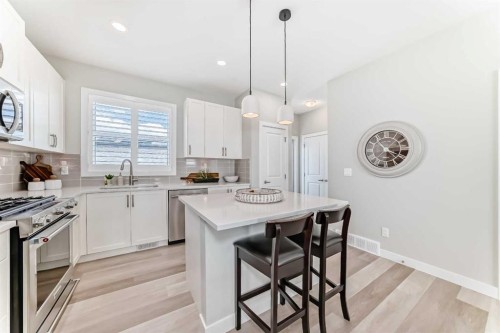 116 Precedence Way, Cochrane, AB - Indoor Photo Showing Kitchen With Upgraded Kitchen