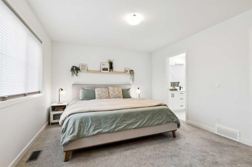 44 Creekside Boulevard Sw, Calgary, AB - Indoor Photo Showing Bedroom