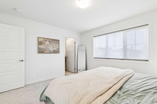 44 Creekside Boulevard Sw, Calgary, AB - Indoor Photo Showing Bedroom