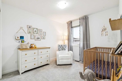44 Creekside Boulevard Sw, Calgary, AB - Indoor Photo Showing Bedroom