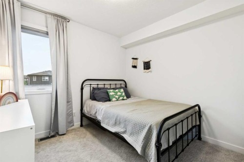 44 Creekside Boulevard Sw, Calgary, AB - Indoor Photo Showing Bedroom