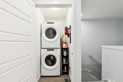 44 Creekside Boulevard Sw, Calgary, AB - Indoor Photo Showing Laundry Room