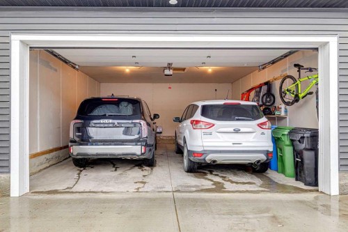 44 Creekside Boulevard Sw, Calgary, AB - Indoor Photo Showing Garage