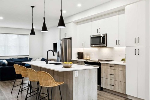 44 Creekside Boulevard Sw, Calgary, AB - Indoor Photo Showing Kitchen With Stainless Steel Kitchen With Upgraded Kitchen