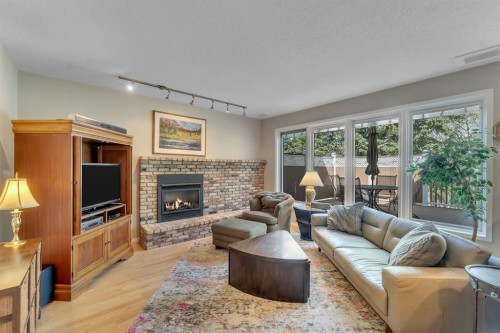 28 Woodacres Way Sw, Calgary, AB - Indoor Photo Showing Living Room With Fireplace