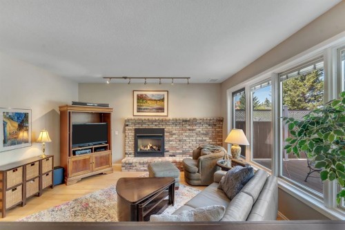 28 Woodacres Way Sw, Calgary, AB - Indoor Photo Showing Living Room With Fireplace