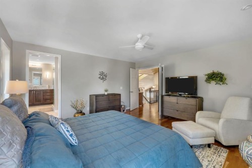 28 Woodacres Way Sw, Calgary, AB - Indoor Photo Showing Bedroom