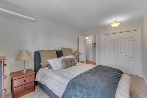 28 Woodacres Way Sw, Calgary, AB - Indoor Photo Showing Bedroom