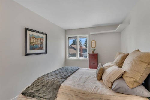 28 Woodacres Way Sw, Calgary, AB - Indoor Photo Showing Bedroom