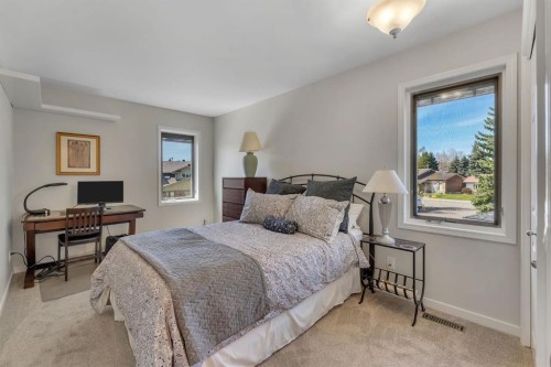 28 Woodacres Way Sw, Calgary, AB - Indoor Photo Showing Bedroom