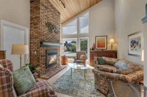 28 Woodacres Way Sw, Calgary, AB - Indoor Photo Showing Living Room With Fireplace