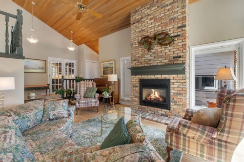 28 Woodacres Way Sw, Calgary, AB - Indoor Photo Showing Living Room With Fireplace