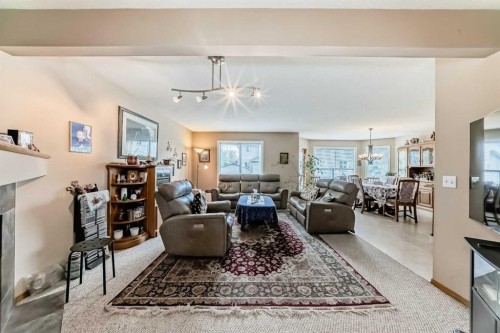 203 West Lakeview Circle, Chestermere, AB - Indoor Photo Showing Living Room With Fireplace