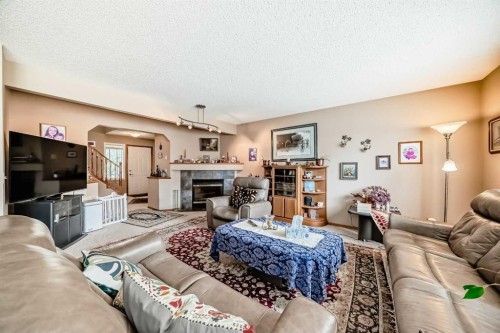 203 West Lakeview Circle, Chestermere, AB - Indoor Photo Showing Living Room With Fireplace