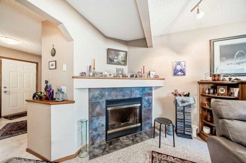 203 West Lakeview Circle, Chestermere, AB - Indoor Photo Showing Living Room With Fireplace