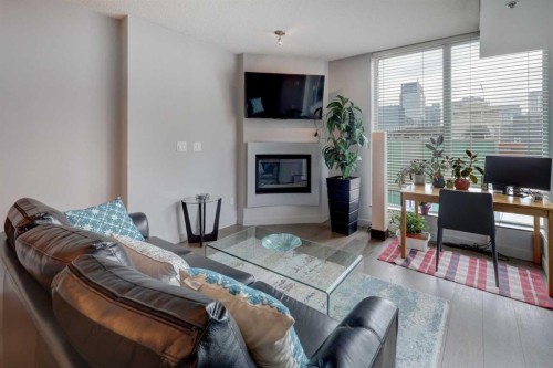 1406-888 4 Avenue Sw, Calgary, AB - Indoor With Fireplace