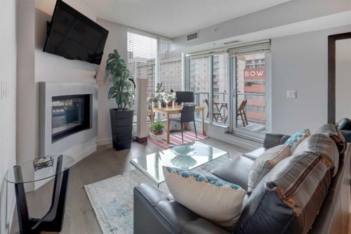 1406-888 4 Avenue Sw, Calgary, AB - Indoor Photo Showing Living Room With Fireplace