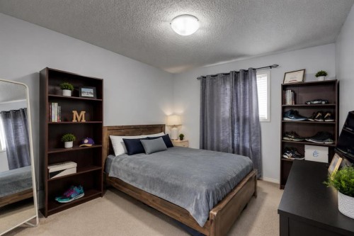 47 Westmount Road, Okotoks, AB - Indoor Photo Showing Bedroom