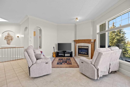 4580 Hamptons Way Nw, Calgary, AB - Indoor Photo Showing Living Room With Fireplace