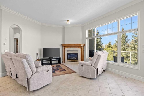 4580 Hamptons Way Nw, Calgary, AB - Indoor Photo Showing Living Room With Fireplace