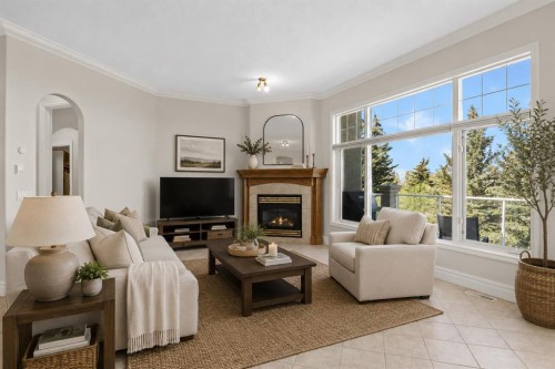 4580 Hamptons Way Nw, Calgary, AB - Indoor Photo Showing Living Room With Fireplace