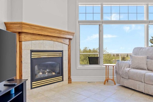 4580 Hamptons Way Nw, Calgary, AB - Indoor Photo Showing Living Room With Fireplace