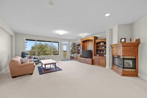 4580 Hamptons Way Nw, Calgary, AB - Indoor Photo Showing Living Room With Fireplace