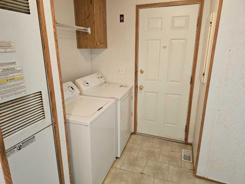 64 Westover Avenue, Claresholm, AB - Indoor Photo Showing Laundry Room
