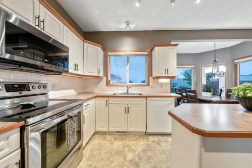 46 4 Street Ne, Langdon, AB - Indoor Photo Showing Kitchen With Double Sink