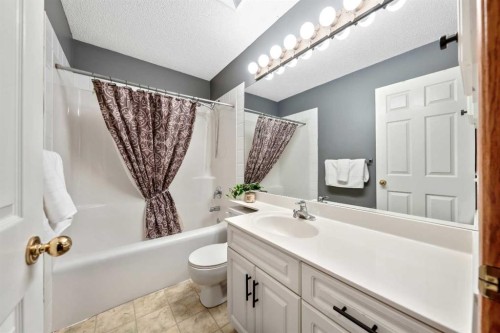 46 4 Street Ne, Langdon, AB - Indoor Photo Showing Bathroom