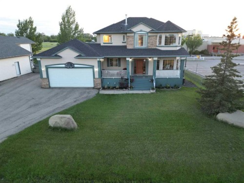 46 4 Street Ne, Langdon, AB - Outdoor With Deck Patio Veranda With Facade
