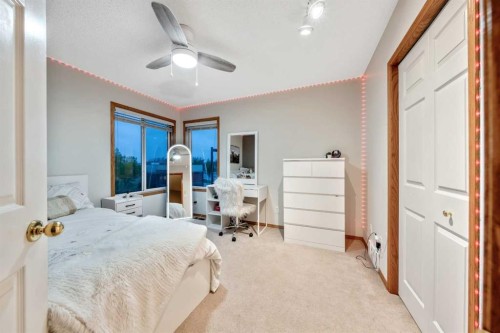 46 4 Street Ne, Langdon, AB - Indoor Photo Showing Bedroom