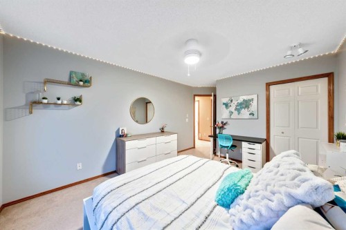 46 4 Street Ne, Langdon, AB - Indoor Photo Showing Bedroom