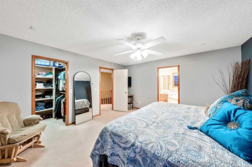 46 4 Street Ne, Langdon, AB - Indoor Photo Showing Bedroom