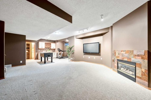 46 4 Street Ne, Langdon, AB - Indoor With Fireplace