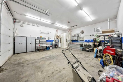 46 4 Street Ne, Langdon, AB - Indoor Photo Showing Garage
