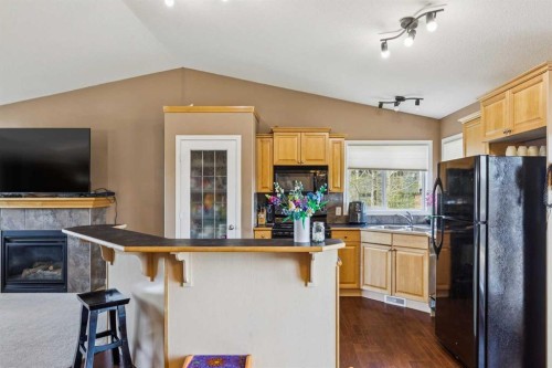 232 Hillcrest Court, Strathmore, AB - Indoor Photo Showing Kitchen With Fireplace With Double Sink