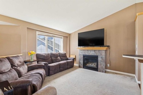 232 Hillcrest Court, Strathmore, AB - Indoor Photo Showing Living Room With Fireplace