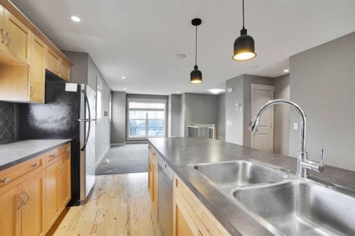 124 Lavender Link, Chestermere, AB - Indoor Photo Showing Kitchen With Double Sink