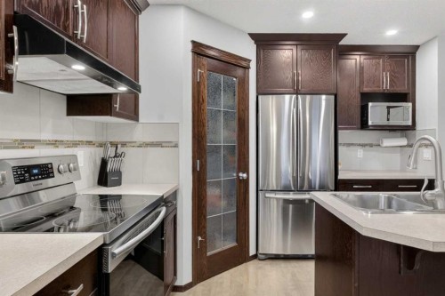22 Autumn Green Se, Calgary, AB - Indoor Photo Showing Kitchen With Stainless Steel Kitchen With Double Sink With Upgraded Kitchen