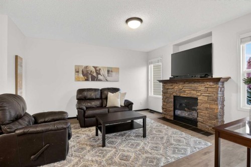 22 Autumn Green Se, Calgary, AB - Indoor Photo Showing Living Room With Fireplace