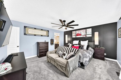 116 Kingsland Court Se, Airdrie, AB - Indoor Photo Showing Bedroom