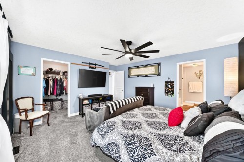 116 Kingsland Court Se, Airdrie, AB - Indoor Photo Showing Bedroom