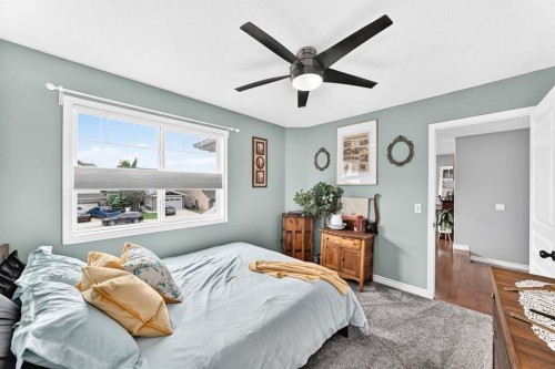 116 Kingsland Court Se, Airdrie, AB - Indoor Photo Showing Bedroom
