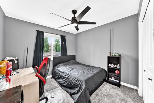 116 Kingsland Court Se, Airdrie, AB - Indoor Photo Showing Bedroom