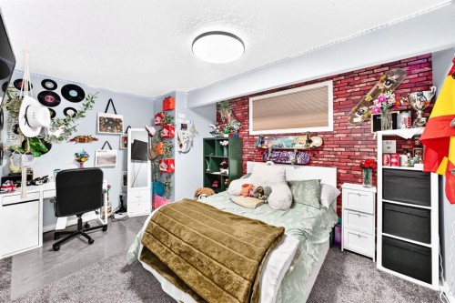 116 Kingsland Court Se, Airdrie, AB - Indoor Photo Showing Bedroom