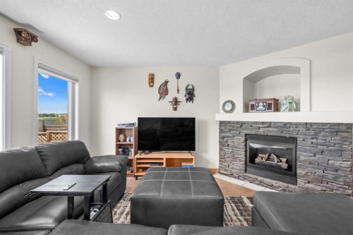 184 Somerglen Common Sw, Calgary, AB - Indoor Photo Showing Living Room With Fireplace