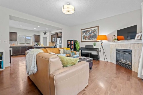 3-1916 36 Street Sw, Calgary, AB - Indoor Photo Showing Living Room With Fireplace